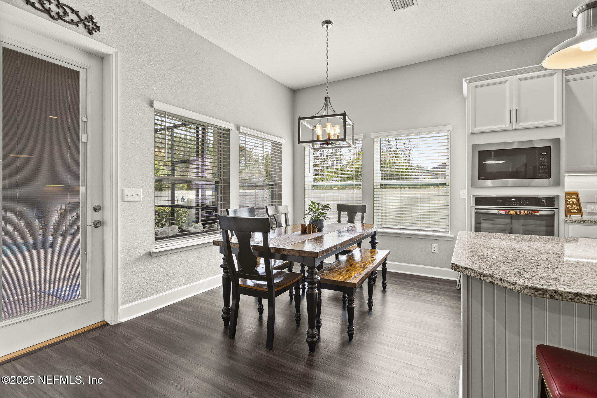 45 Manor Lane St. Johns, FL 32259 - Photo 16 of 47 a view of a dining room with furniture window and wooden floor