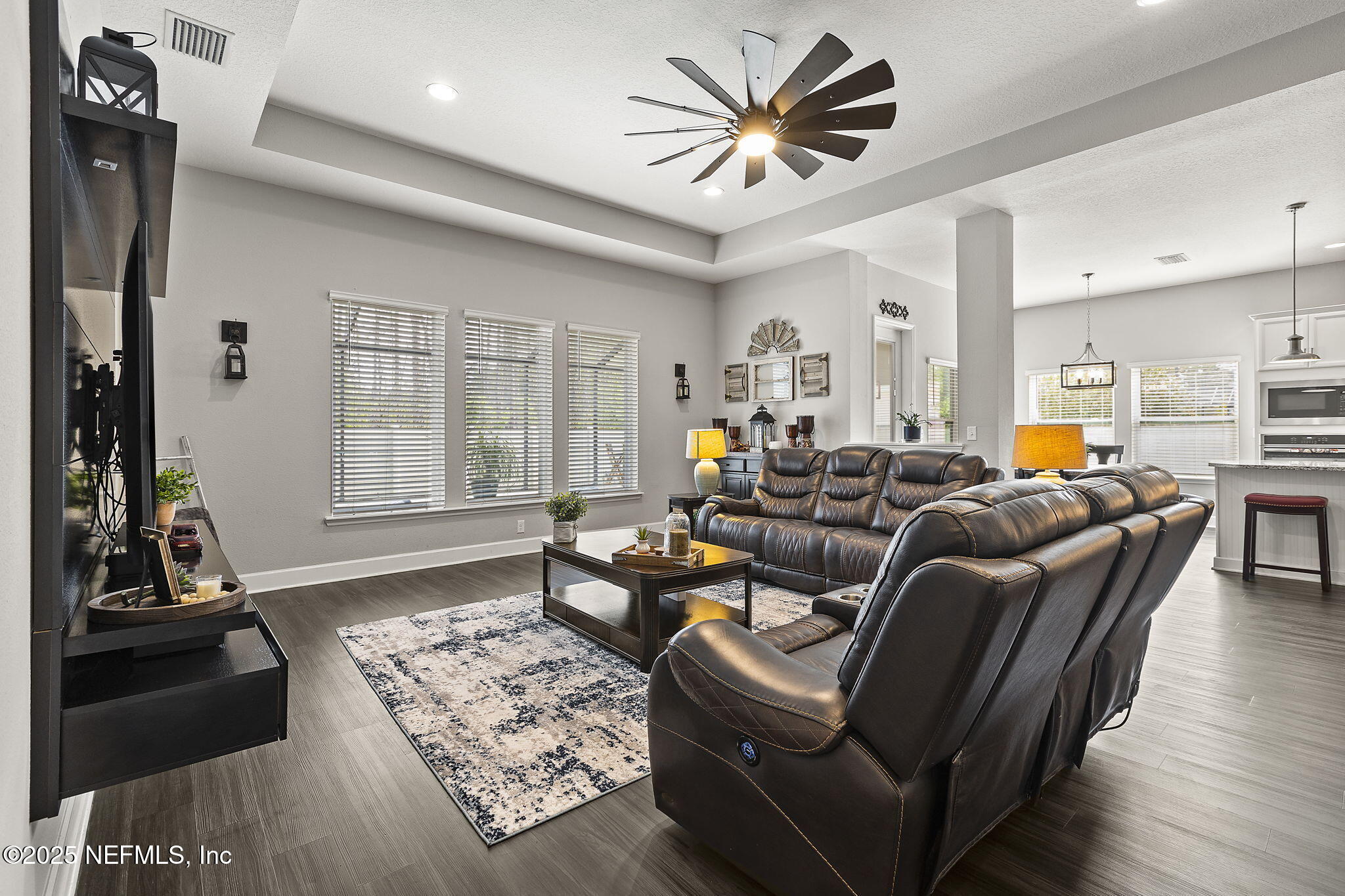 45 Manor Lane St. Johns, FL 32259 - Photo 19 of 47 a living room with furniture two window and a flat screen tv