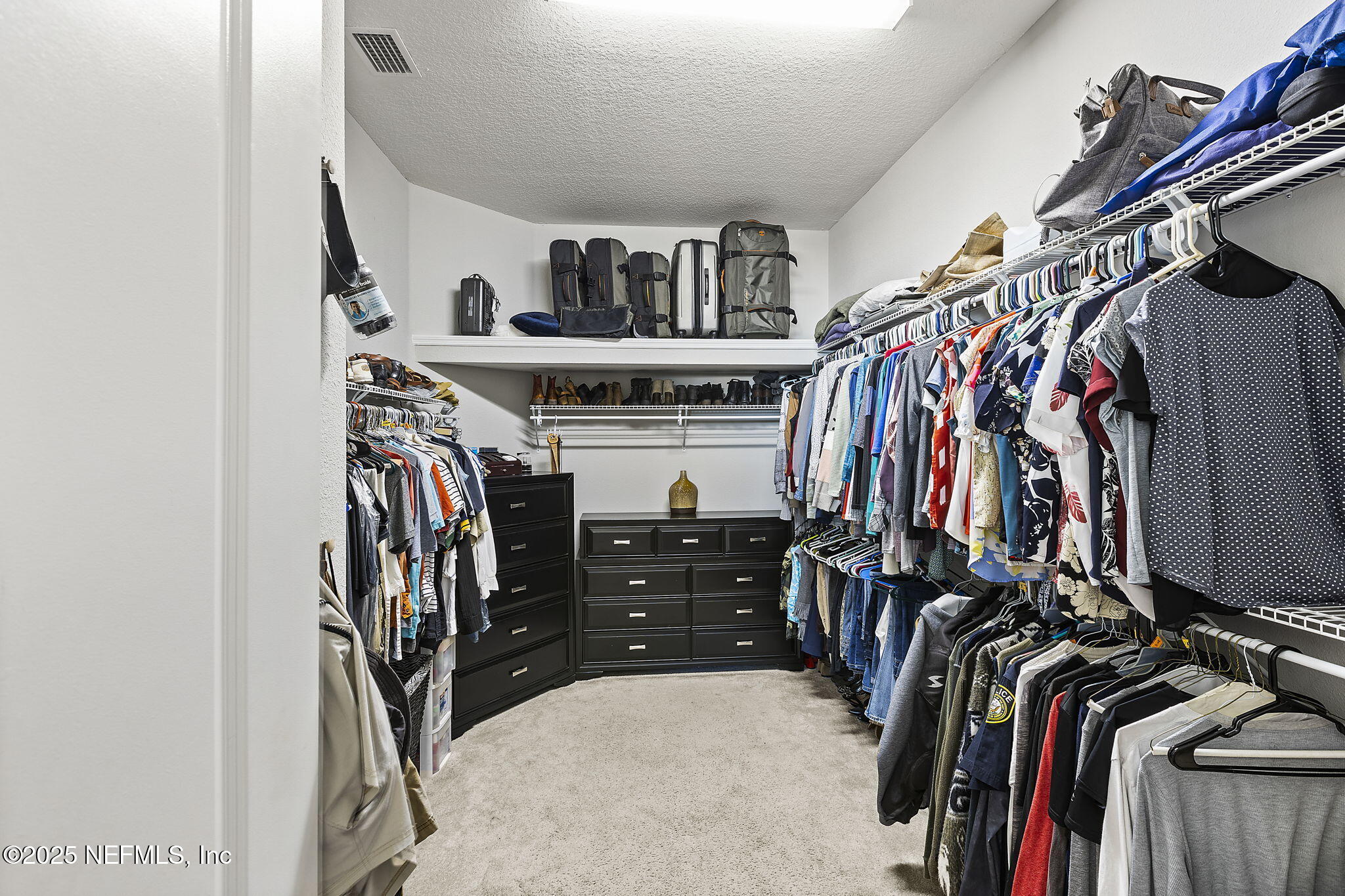 45 Manor Lane St. Johns, FL 32259 - Photo 28 of 47 a view of walk in closet with clothes