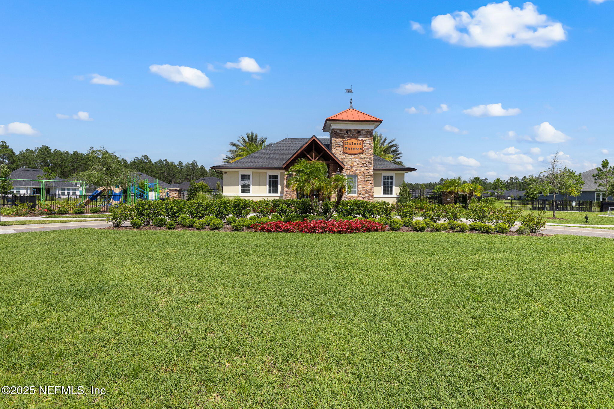 45 Manor Lane St. Johns, FL 32259 - Photo 36 of 47 a front view of a house with a big yard and potted plants