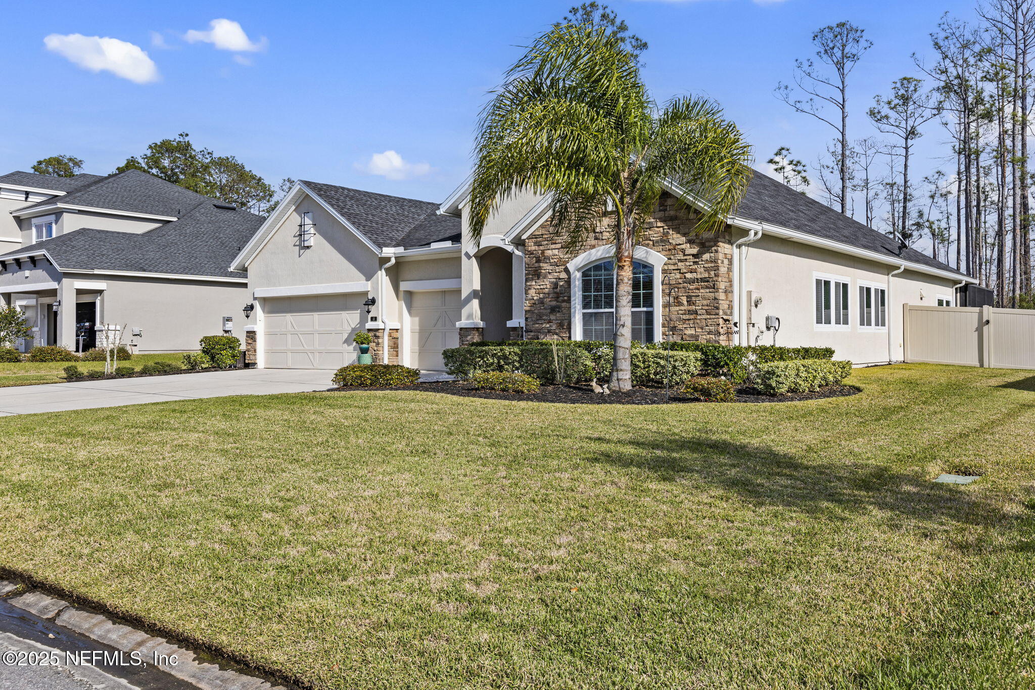 45 Manor Lane St. Johns, FL 32259 - Photo 4 of 47 a front view of a house with a garden