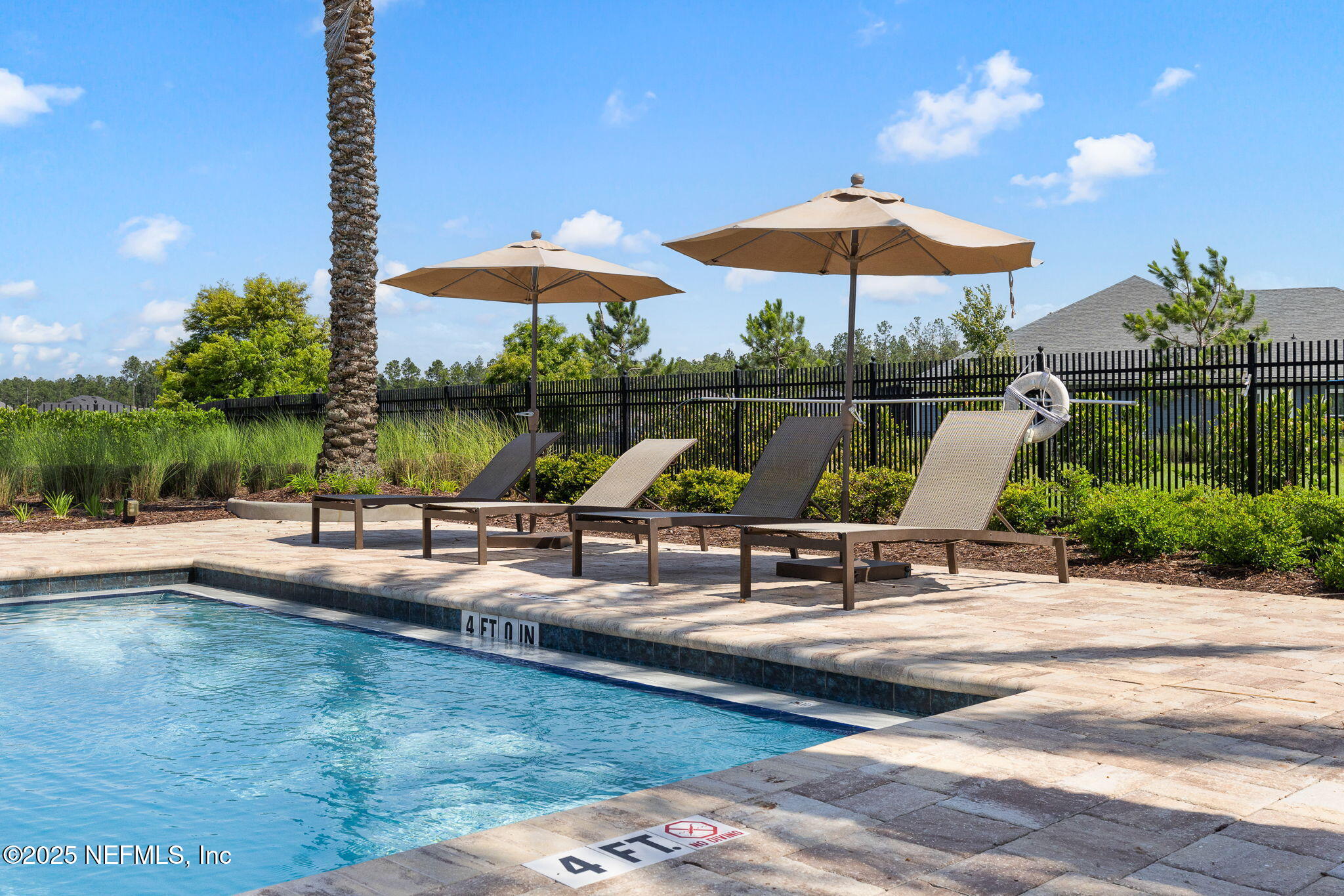 45 Manor Lane St. Johns, FL 32259 - Photo 41 of 47 a view of a swimming pool with a patio