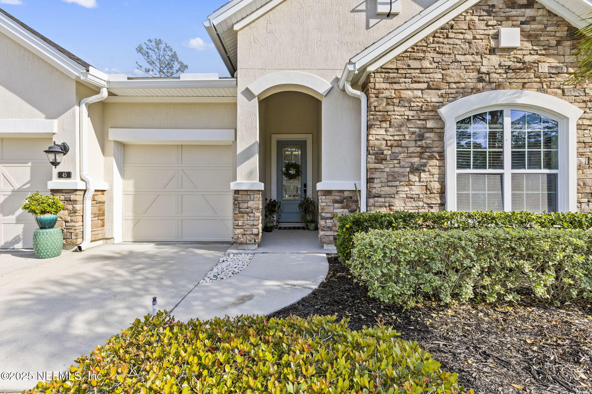 45 Manor Lane St. Johns, FL 32259 - Photo 44 of 47 a front view of a house with garden