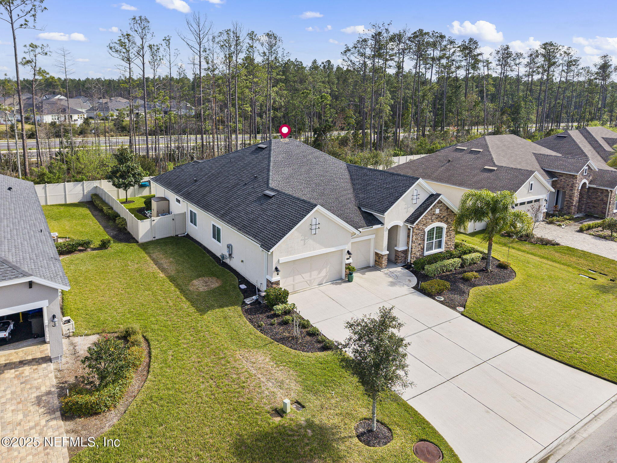 45 Manor Lane St. Johns, FL 32259 - Photo 45 of 47 an aerial view of a house with swimming pool and large trees