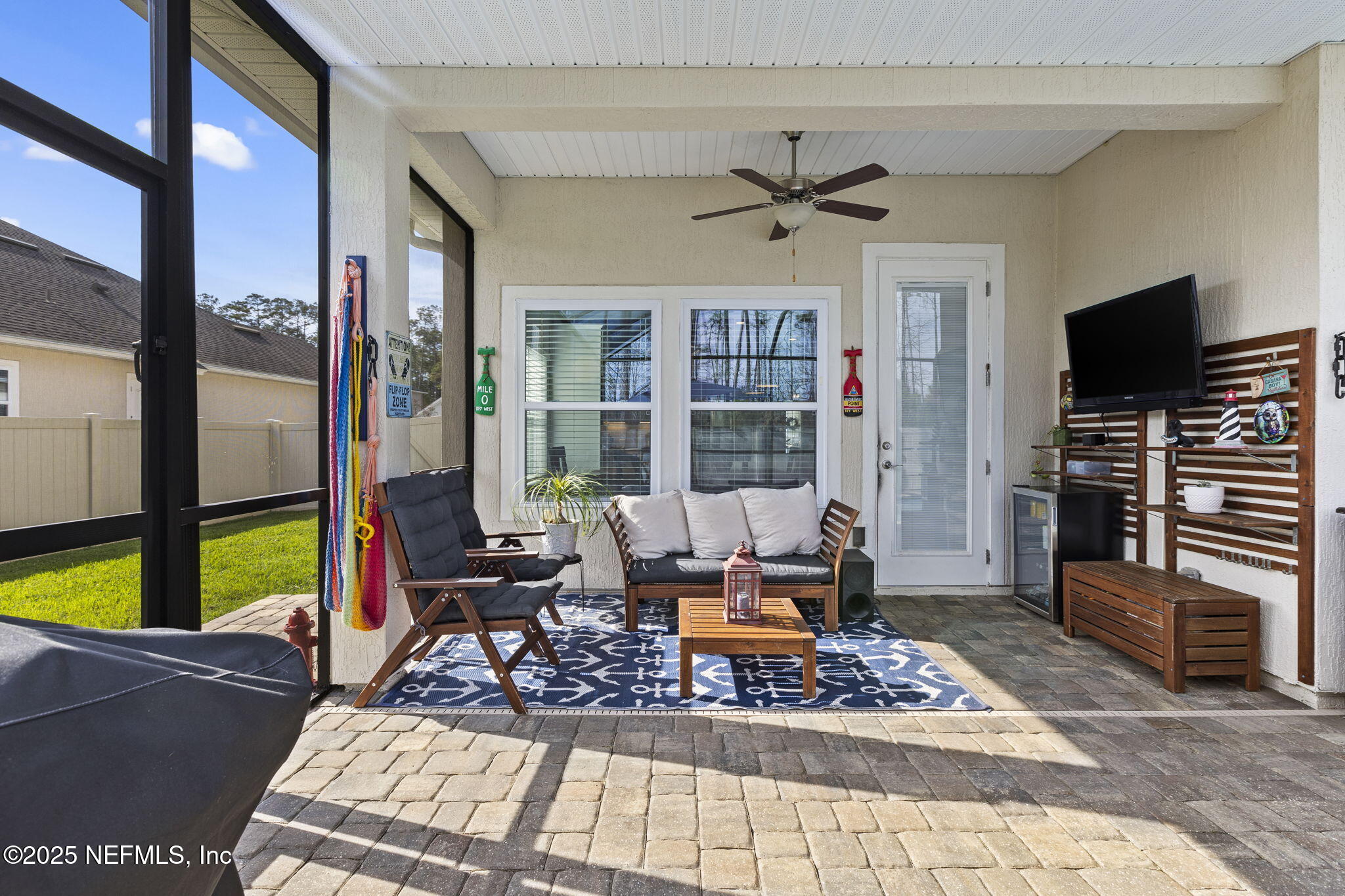 45 Manor Lane St. Johns, FL 32259 - Photo 5 of 47 a living room with furniture a flat screen tv and a table