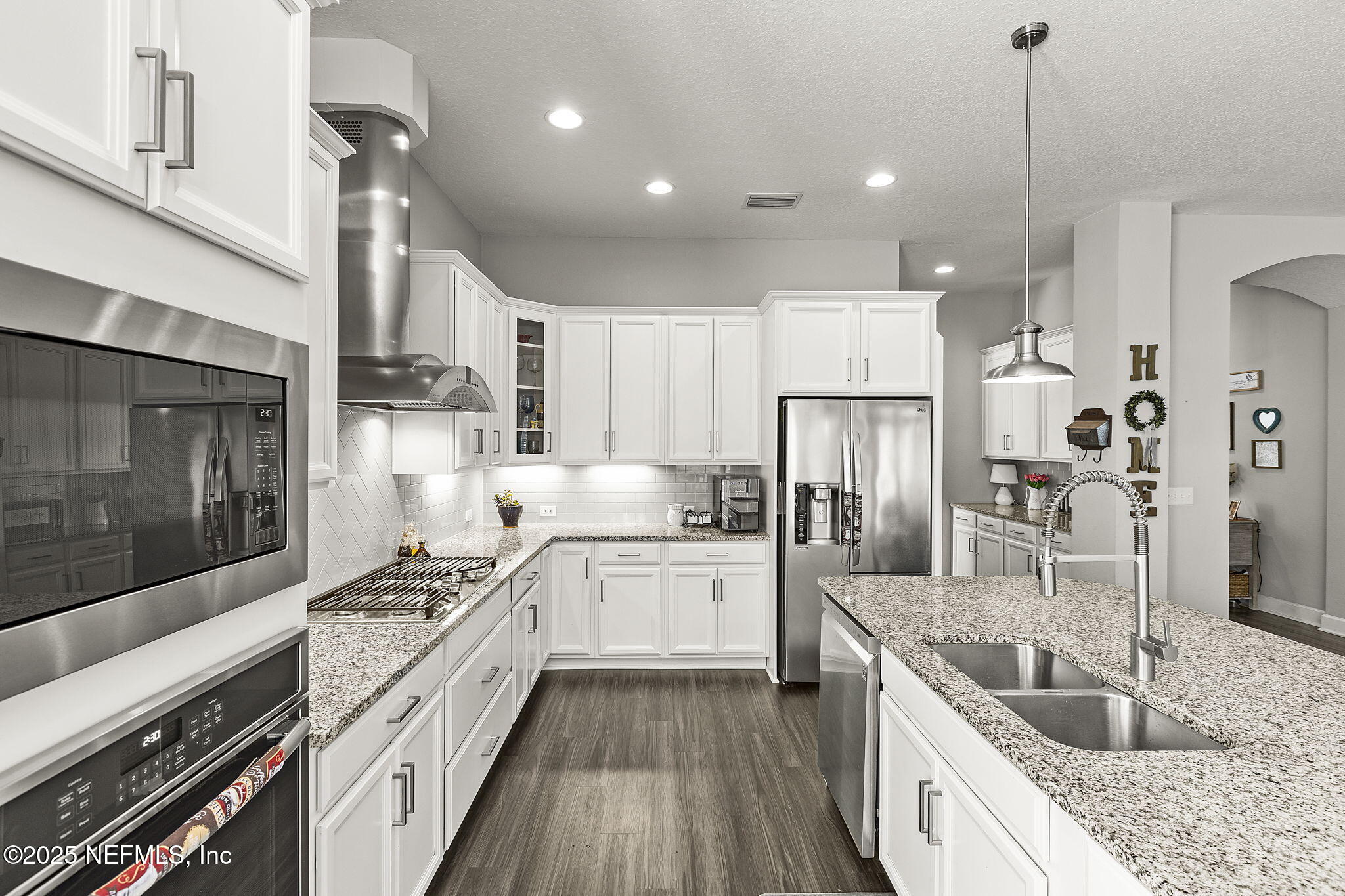 45 Manor Lane St. Johns, FL 32259 - Photo 8 of 47 a kitchen with stainless steel appliances kitchen island granite countertop a sink stove and refrigerator