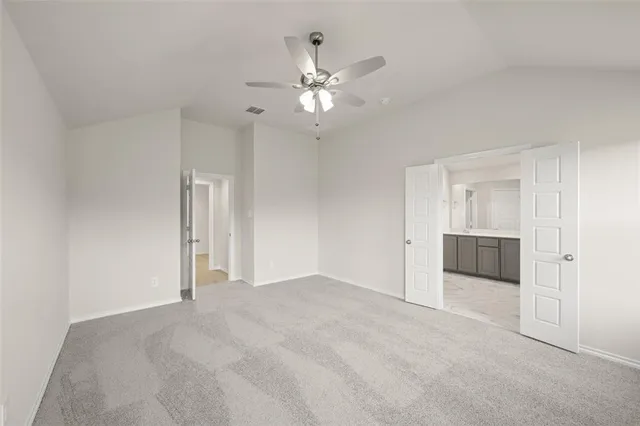 a view of a livingroom with a ceiling fan and window