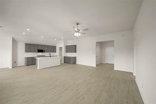 a view of a kitchen with sink and cabinet area