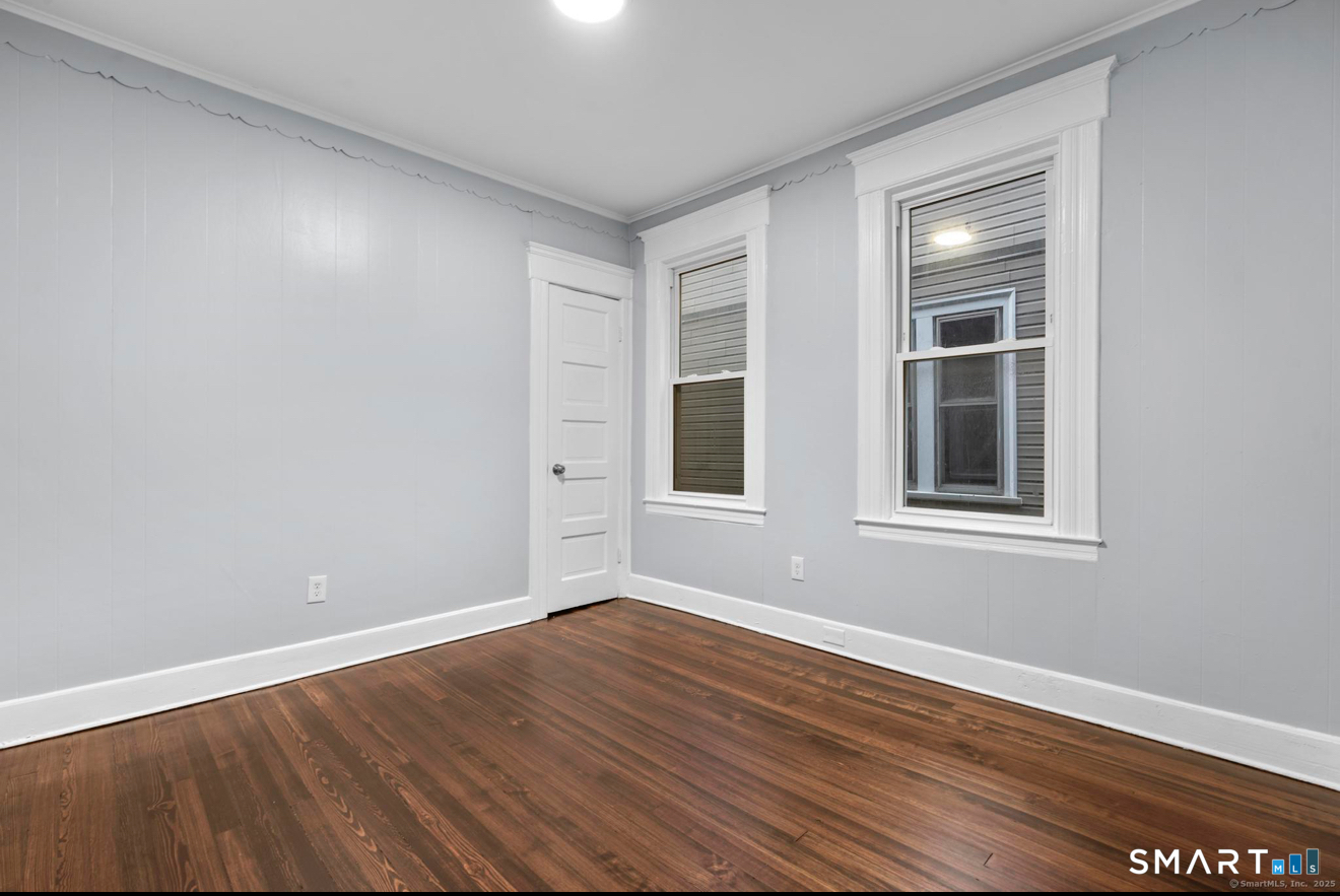 292 West Ivy Street New Haven, CT 06511 - Photo 15 of 16 a view of an empty room with wooden floor and a window