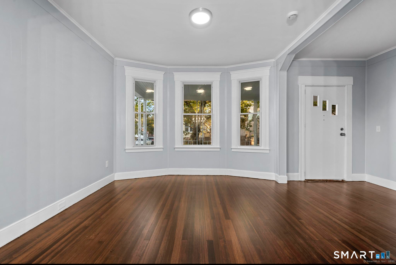 292 West Ivy Street New Haven, CT 06511 - Photo 5 of 16 a view of an empty room with wooden floor and a window
