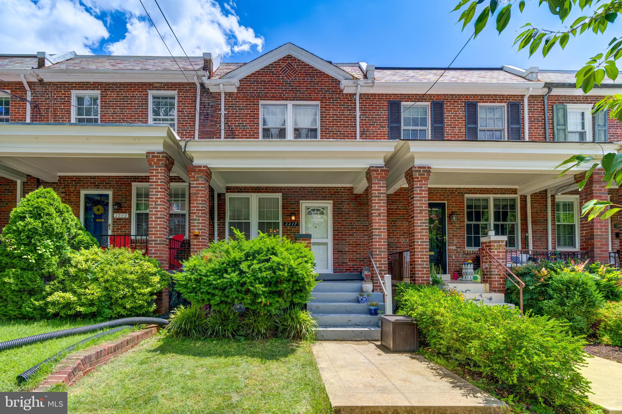 2217 39th Place Northwest Washington, DC 20007 - Photo 1 of 28 front view of a brick house with a yard
