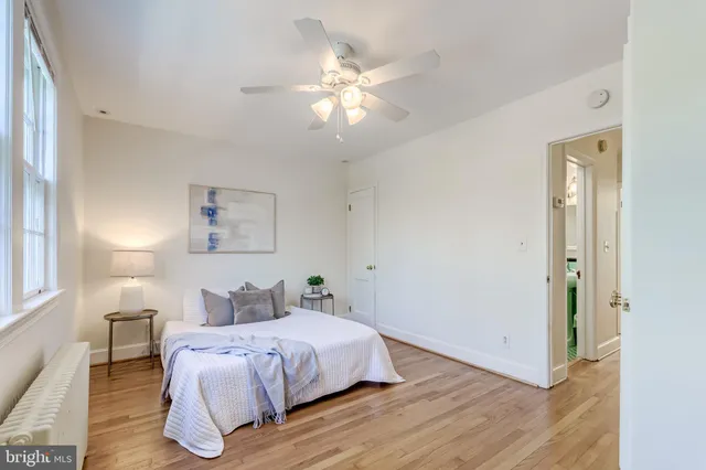 a kitchen with stainless steel appliances white cabinets and a stove