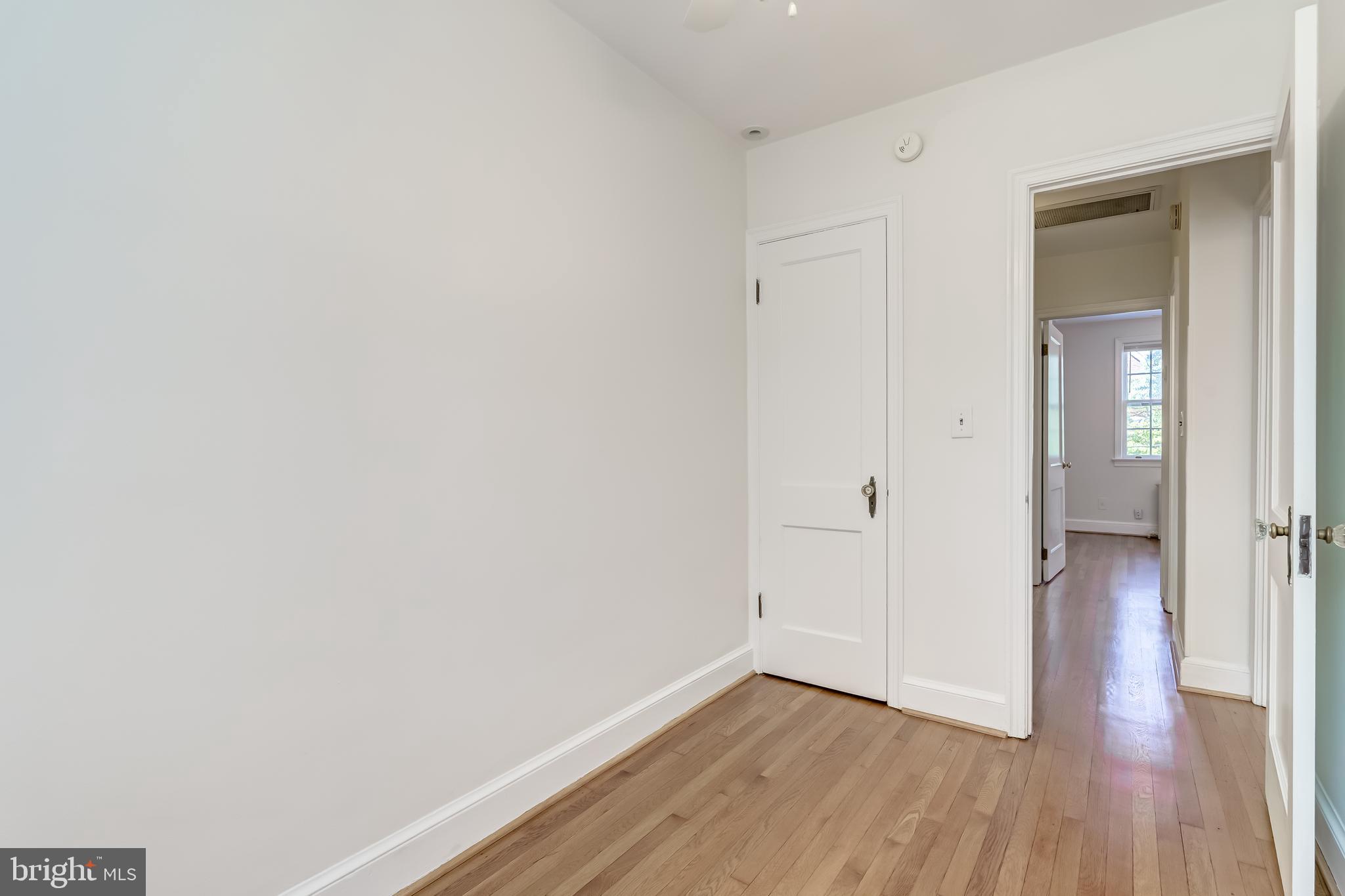 2217 39th Place Northwest Washington, DC 20007 - Photo 15 of 28 a view of an empty room with wooden floor