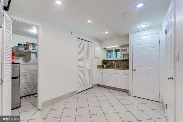 a picture of a bench in front of a wall