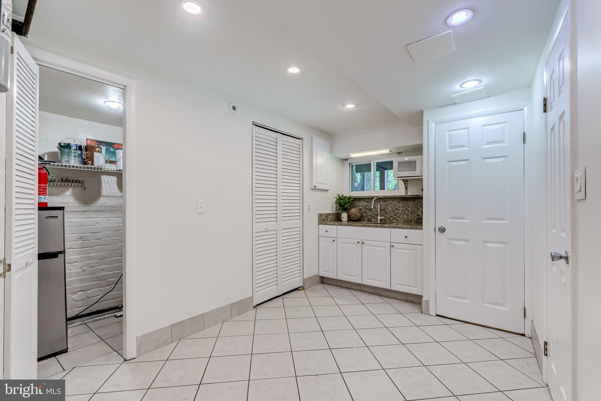 2217 39th Place Northwest Washington, DC 20007 - Photo 19 of 28 a room with white cabinets and window