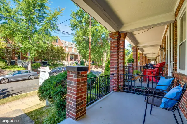 a view of a chairs and tables in the balcony