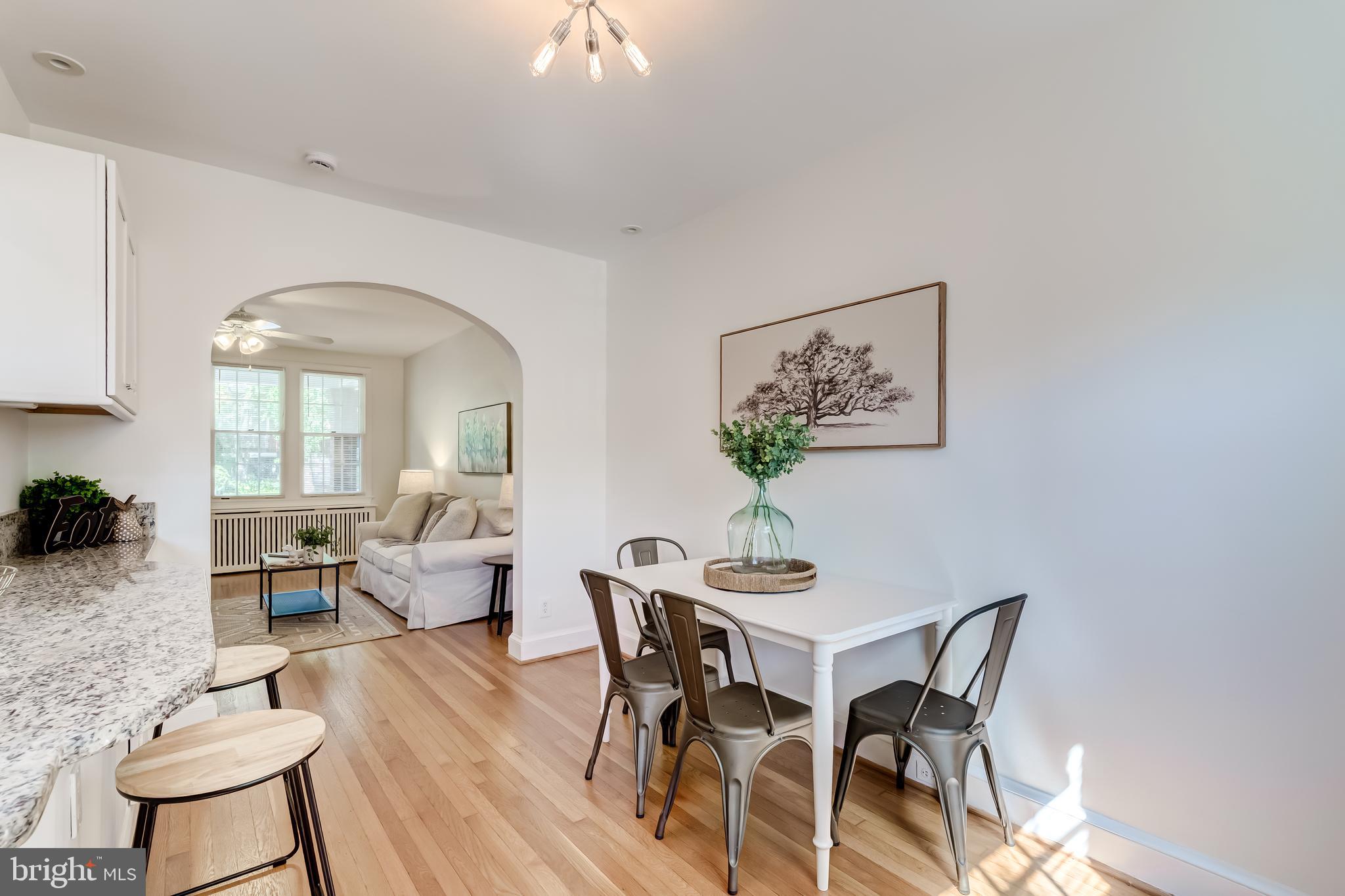 2217 39th Place Northwest Washington, DC 20007 - Photo 7 of 28 a view of a dining room with furniture and wooden floor