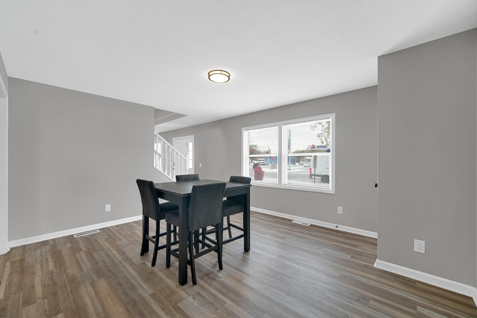3028 West 15th Avenue Gary, IN 46404 - Photo 11 of 30 a view of a dining room with furniture and wooden floor