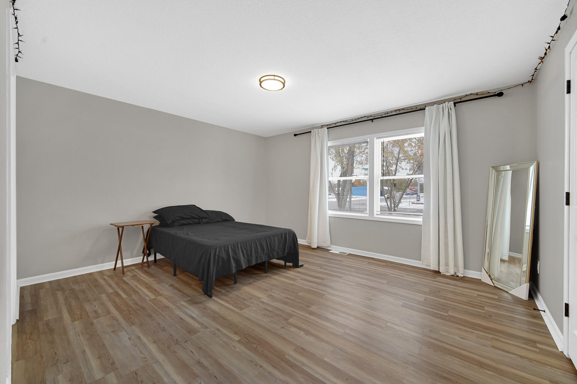 3028 West 15th Avenue Gary, IN 46404 - Photo 12 of 30 a room with a bed and a window
