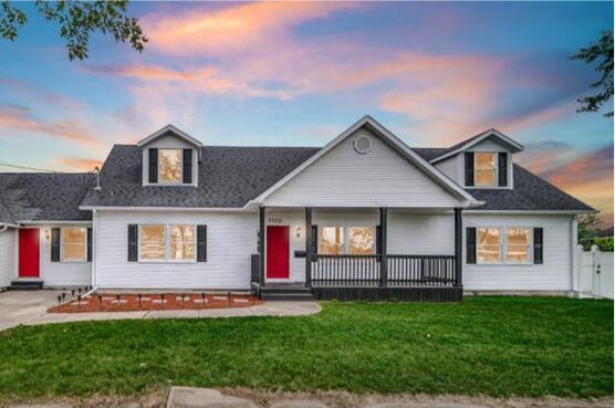 3028 West 15th Avenue Gary, IN 46404 - Photo 2 of 30 a front view of a house with a yard and garage