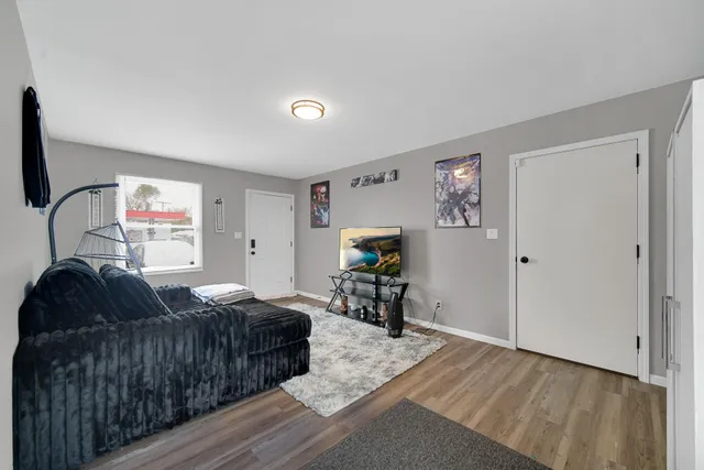 a bedroom with furniture and a window