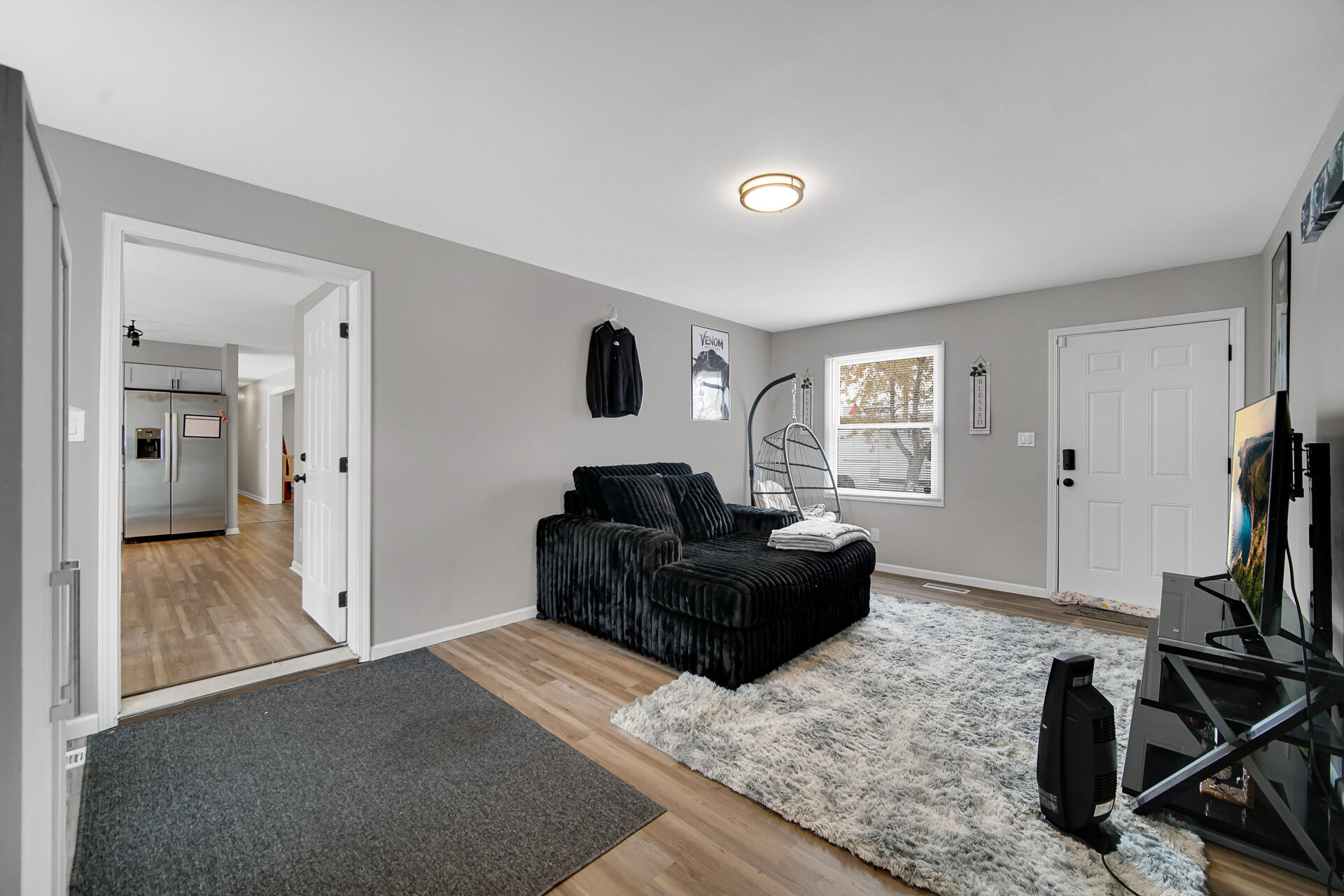 3028 West 15th Avenue Gary, IN 46404 - Photo 30 of 30 a living room with furniture and a flat screen tv