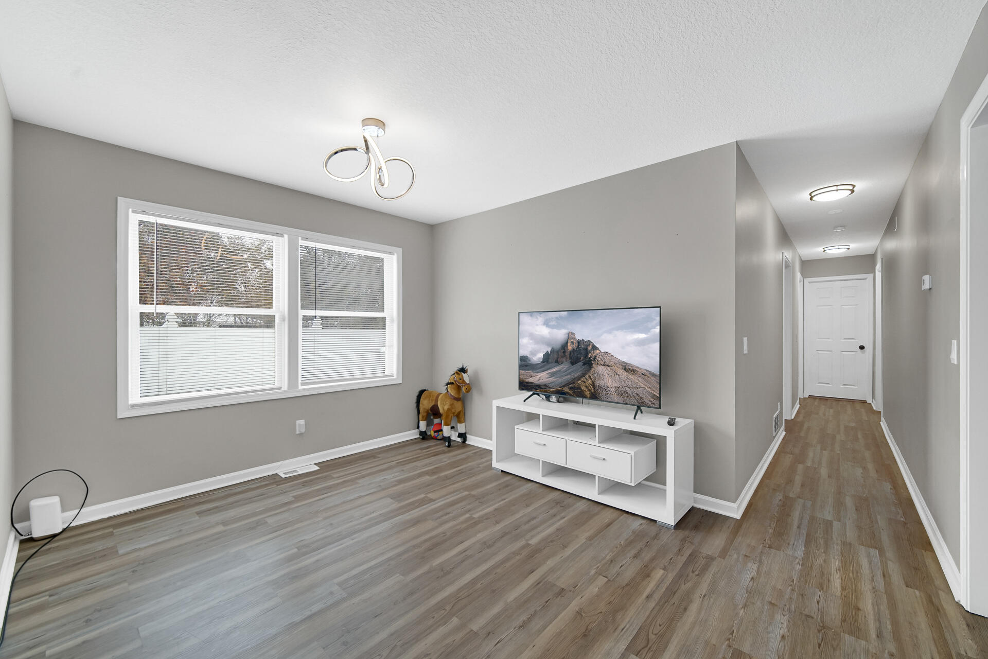 3028 West 15th Avenue Gary, IN 46404 - Photo 6 of 30 a view of livingroom with wooden floor and window