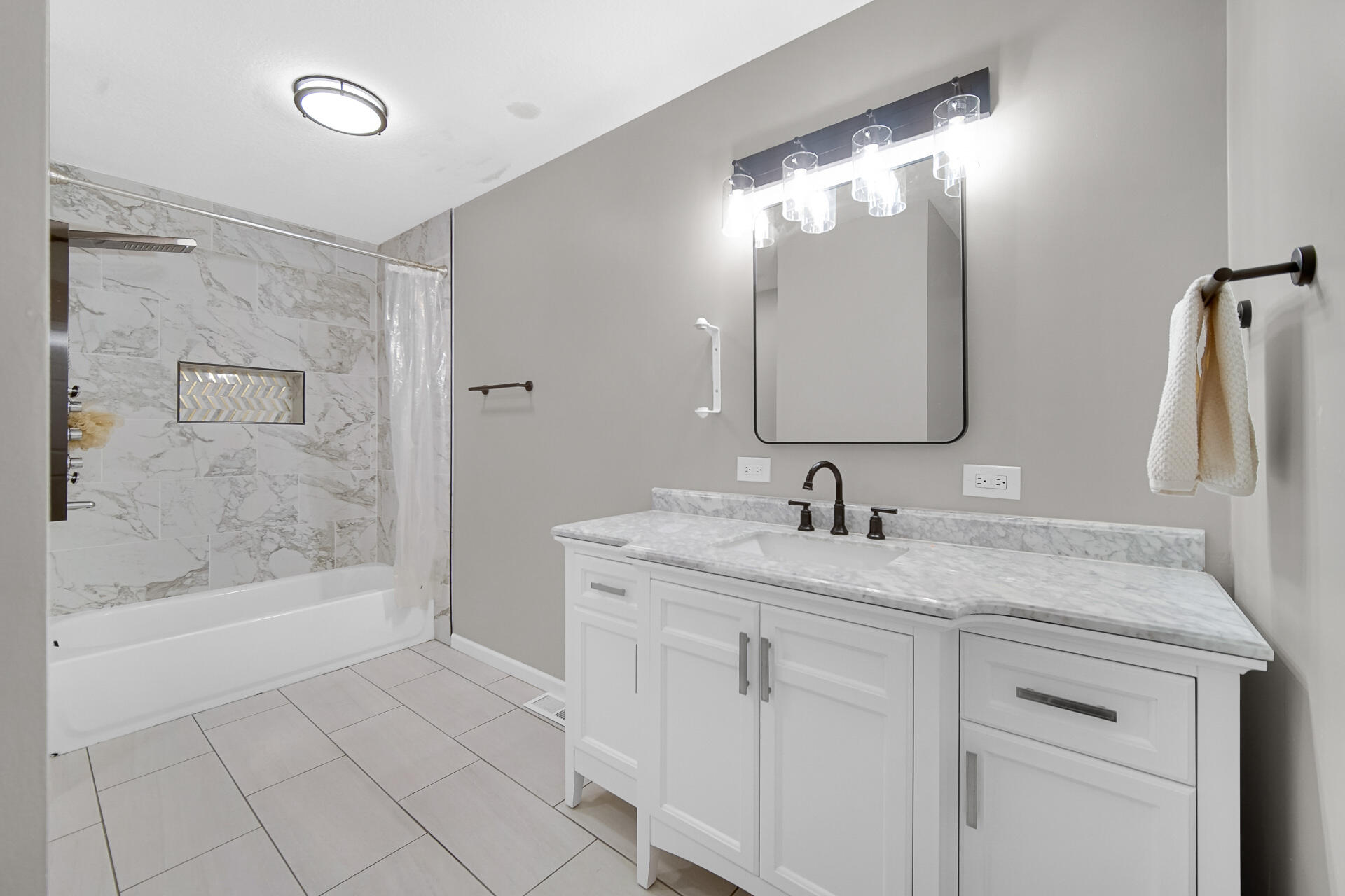 3028 West 15th Avenue Gary, IN 46404 - Photo 10 of 30 a bathroom with a granite countertop sink mirror and bathtub