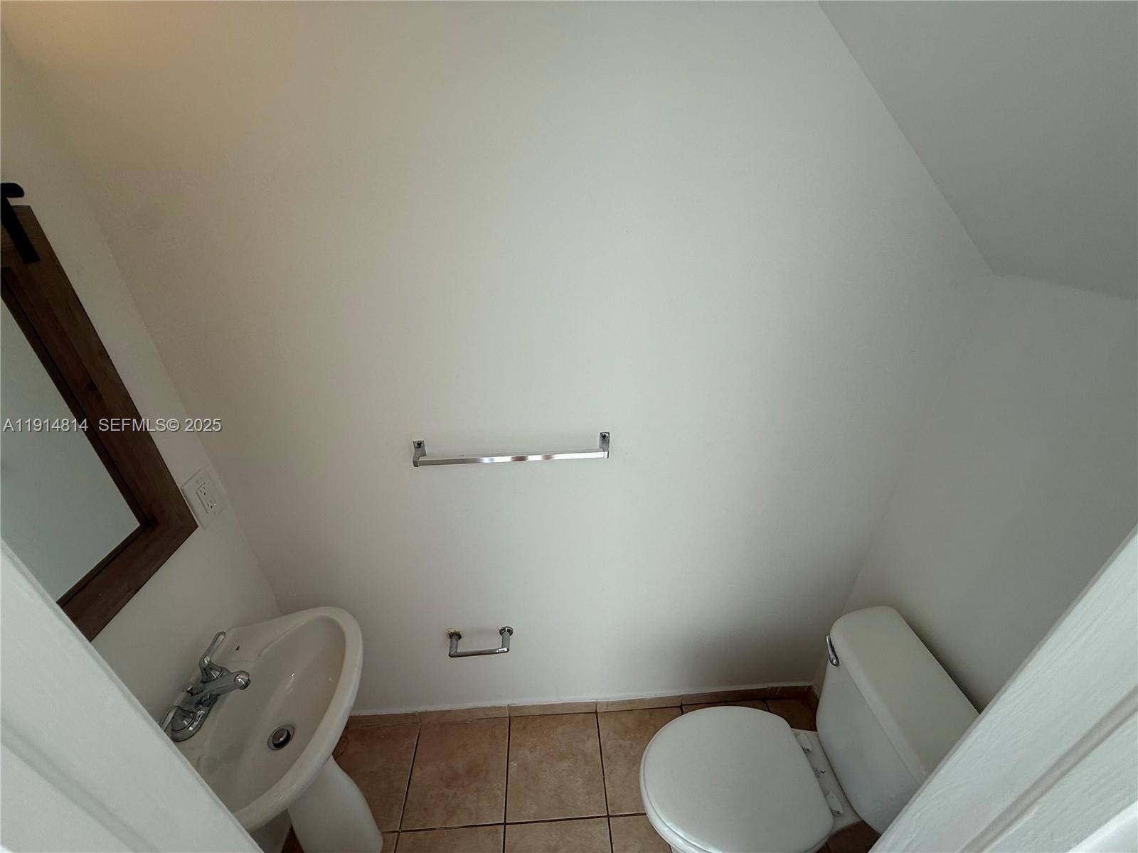 821 Southwest 2nd Street, Unit 7 Miami, FL 33130 - Photo 18 of 29 a bathroom with a toilet and a sink