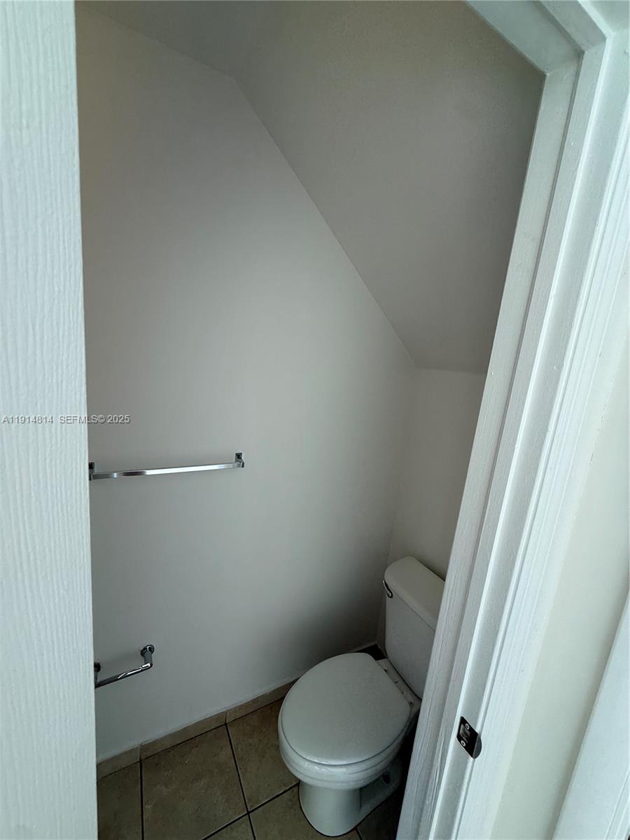 821 Southwest 2nd Street, Unit 7 Miami, FL 33130 - Photo 19 of 29 a white toilet sitting next to a shower