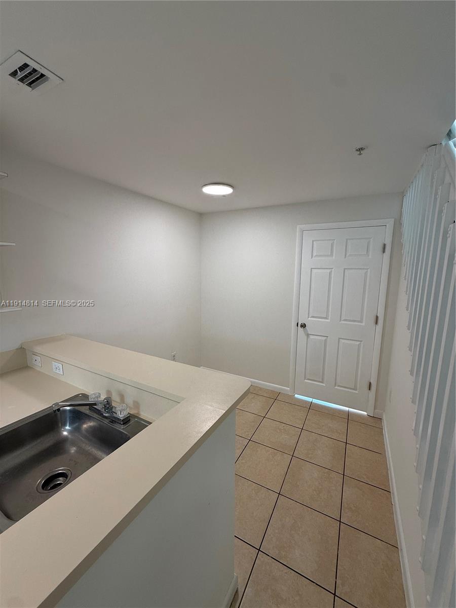 821 Southwest 2nd Street, Unit 7 Miami, FL 33130 - Photo 21 of 29 a kitchen with a sink cabinets and appliances