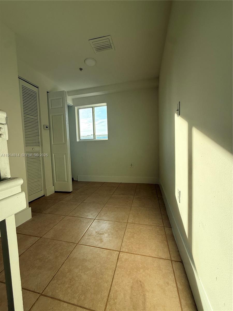 821 Southwest 2nd Street, Unit 7 Miami, FL 33130 - Photo 24 of 29 a view of an empty room with a window
