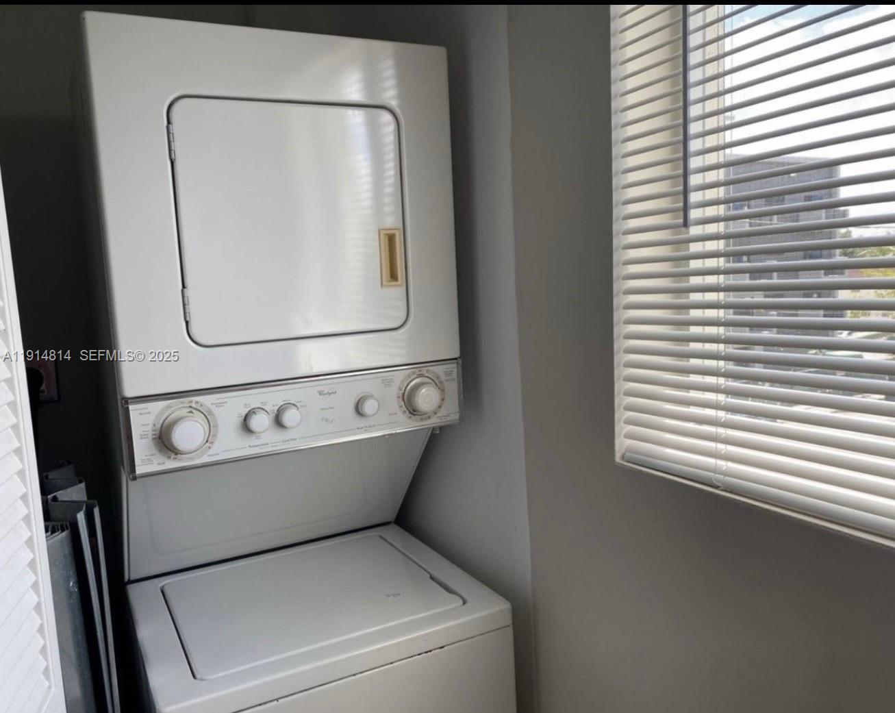 821 Southwest 2nd Street, Unit 7 Miami, FL 33130 - Photo 5 of 29 a utility room with dryer and washer