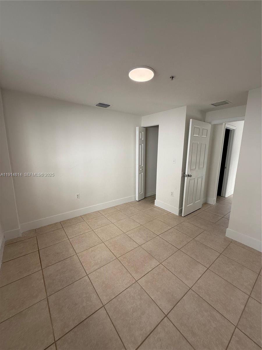 821 Southwest 2nd Street, Unit 7 Miami, FL 33130 - Photo 8 of 29 an empty room with a bathroom