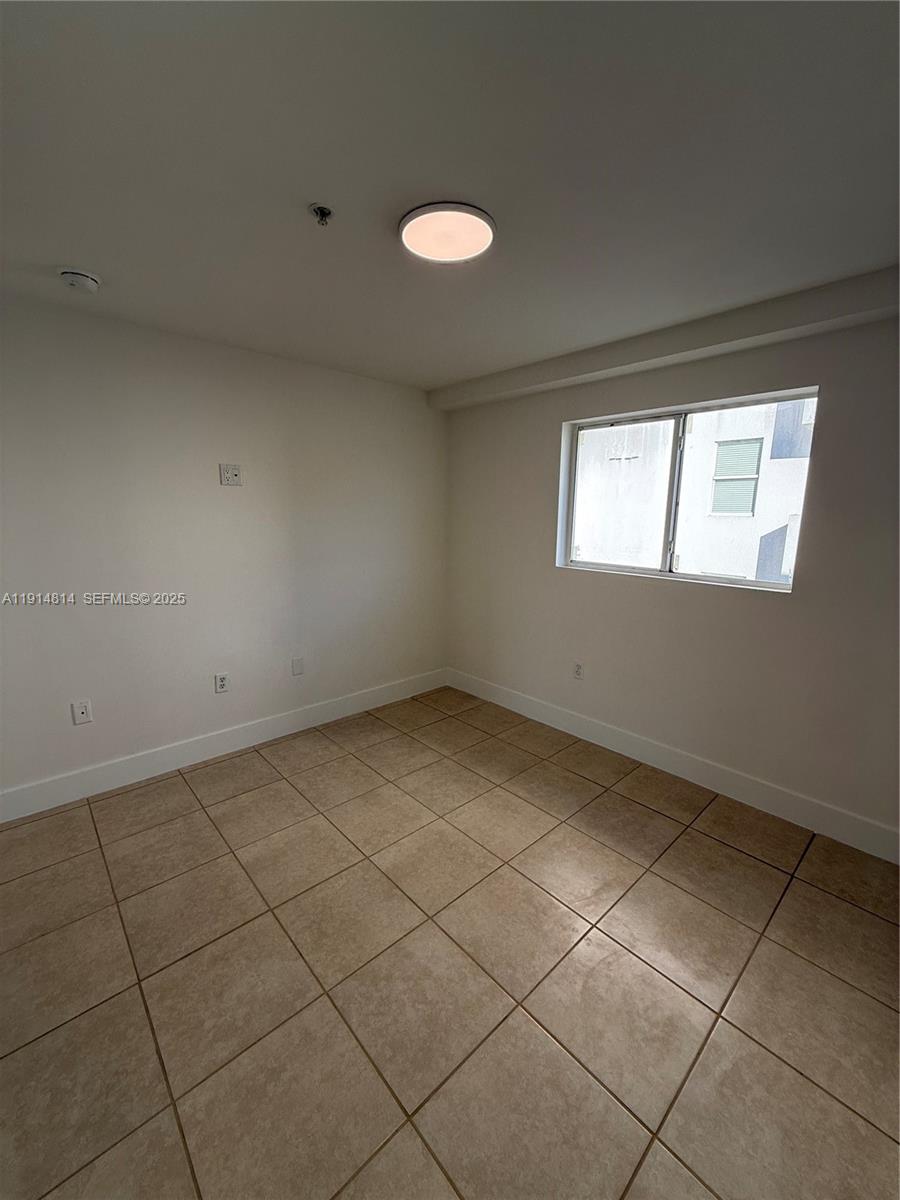 821 Southwest 2nd Street, Unit 7 Miami, FL 33130 - Photo 10 of 29 an empty room with windows
