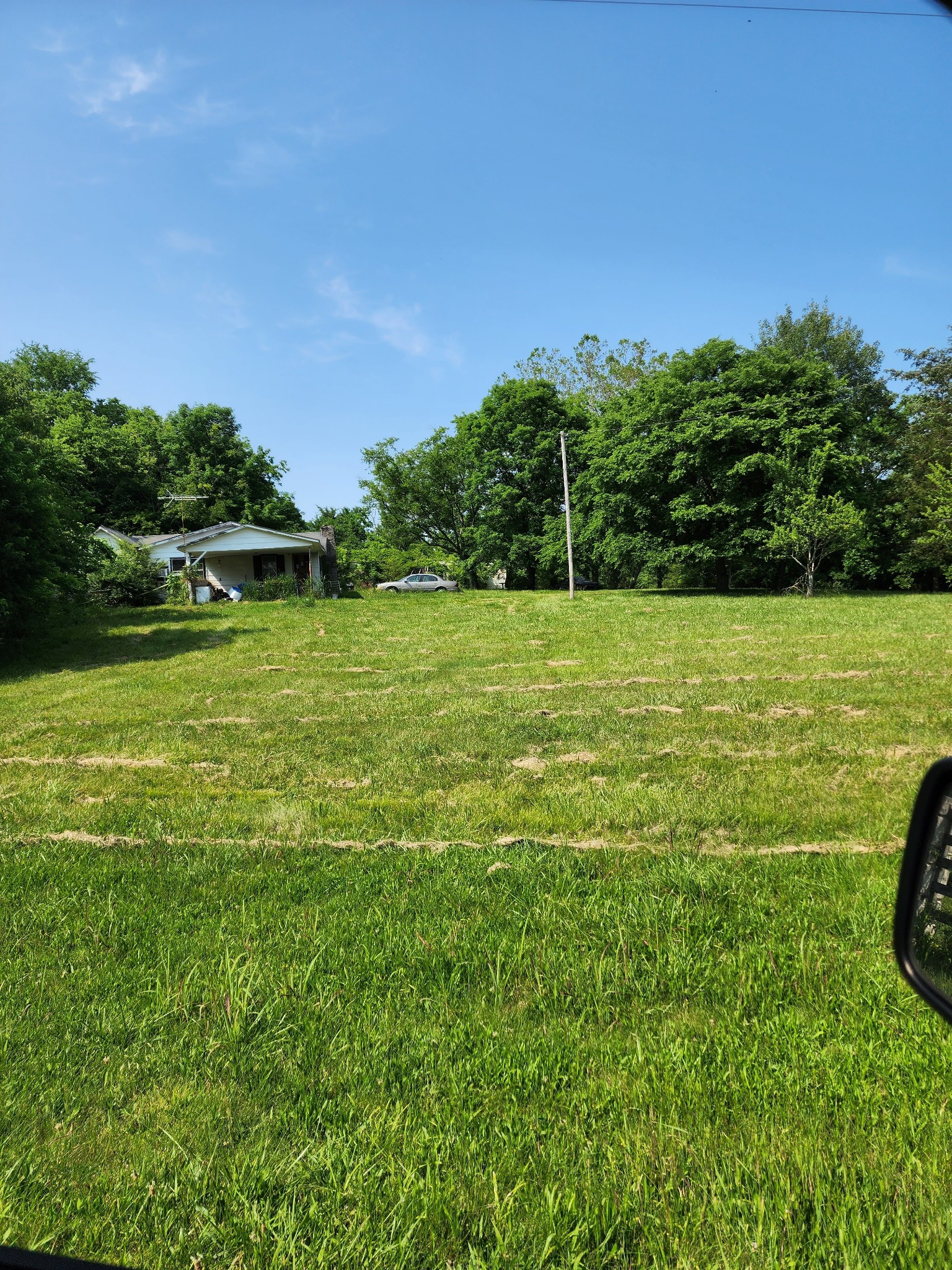 11401 Powells Chapel Road Lebanon, TN 37090 - Photo 1 of 3 a view of a field with a trees in the background