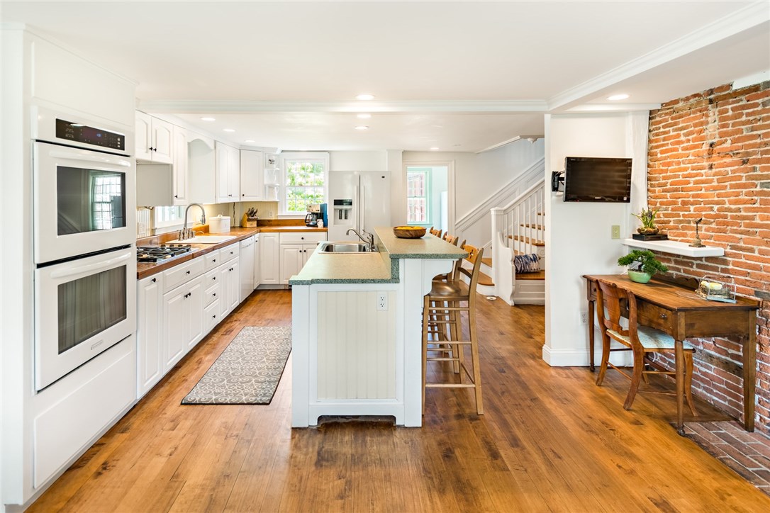 1510 Boston Neck Road North Kingstown, RI 02874 - Photo 10 of 40 Original brick details, butcher block counter tops and back staircase to the second floor.