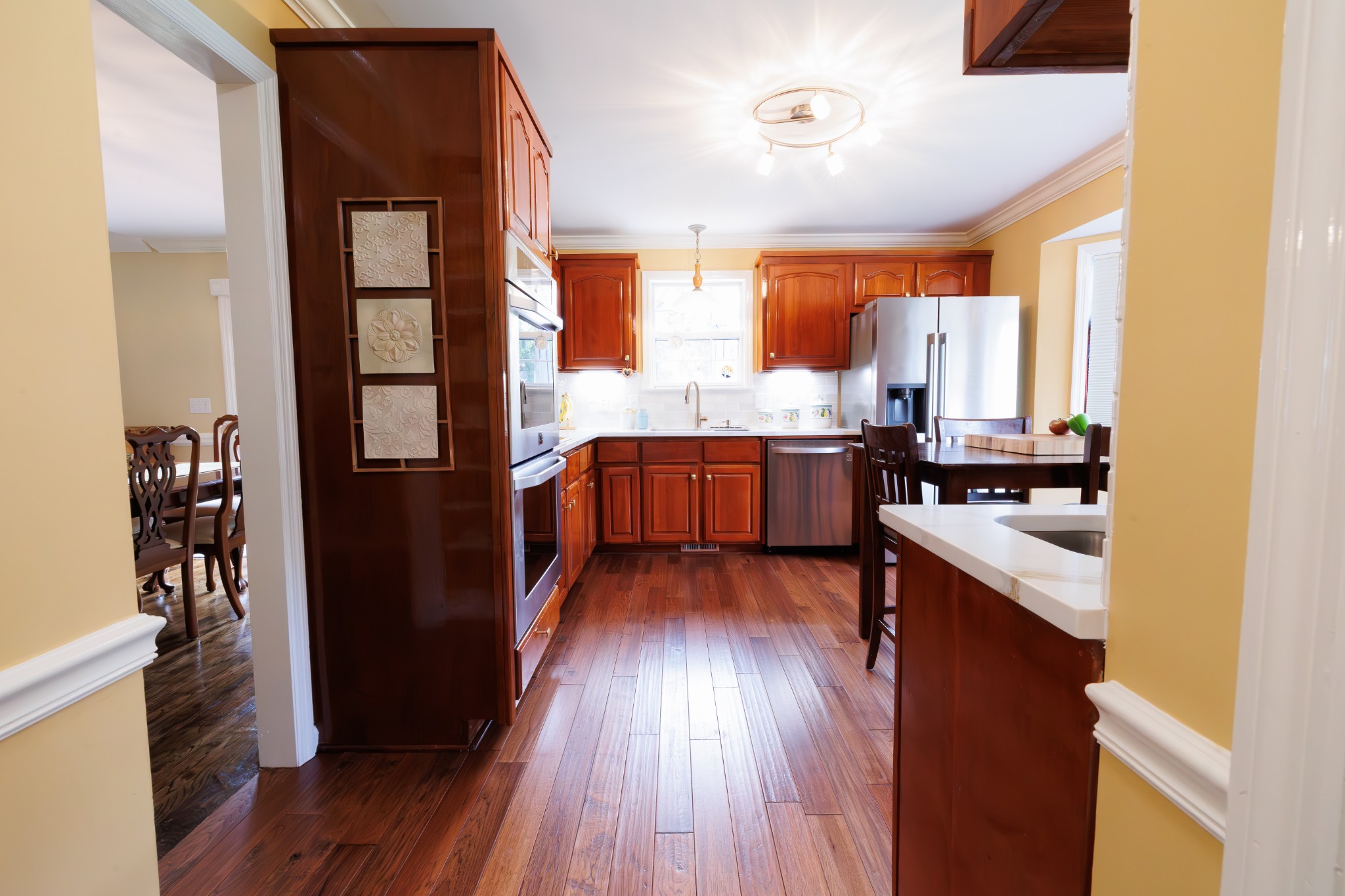 4215 Pate Road Franklin, TN 37064 - Photo 17 of 34 a kitchen with stainless steel appliances granite countertop wooden floors and sink