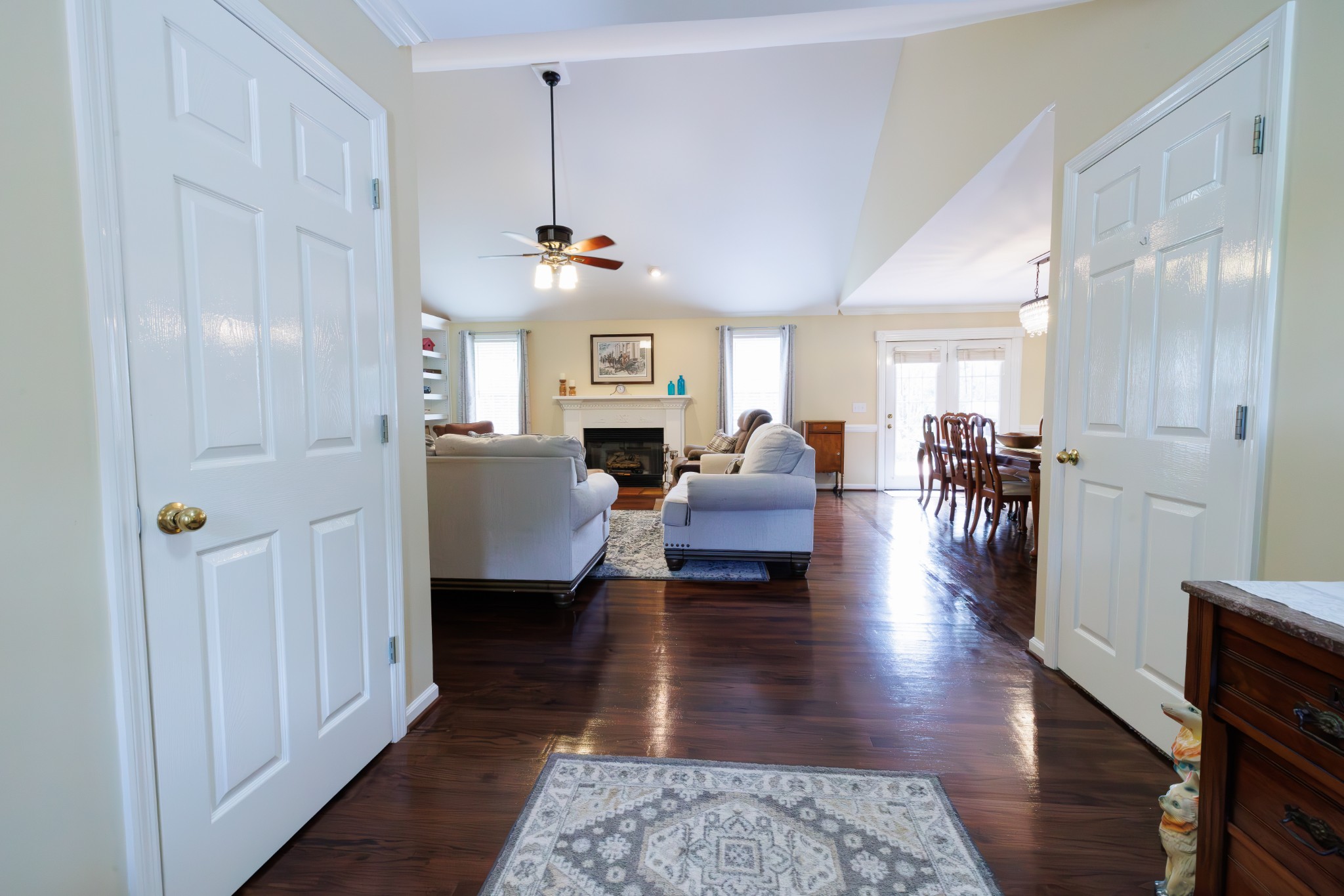 4215 Pate Road Franklin, TN 37064 - Photo 3 of 34 a living room with couches chairs and kitchen view with wooden floor