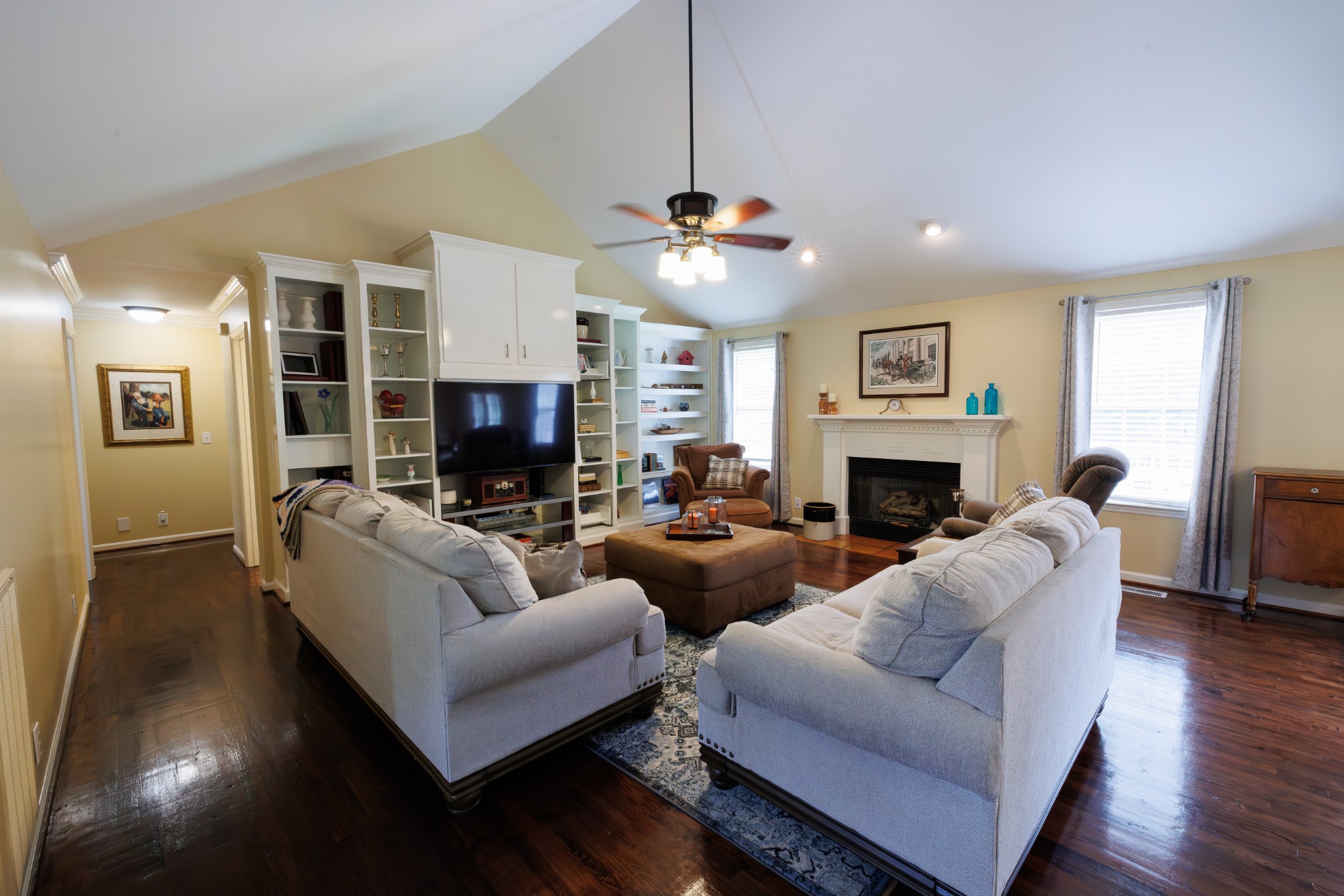 4215 Pate Road Franklin, TN 37064 - Photo 5 of 34 a living room with furniture a fireplace and a flat screen tv