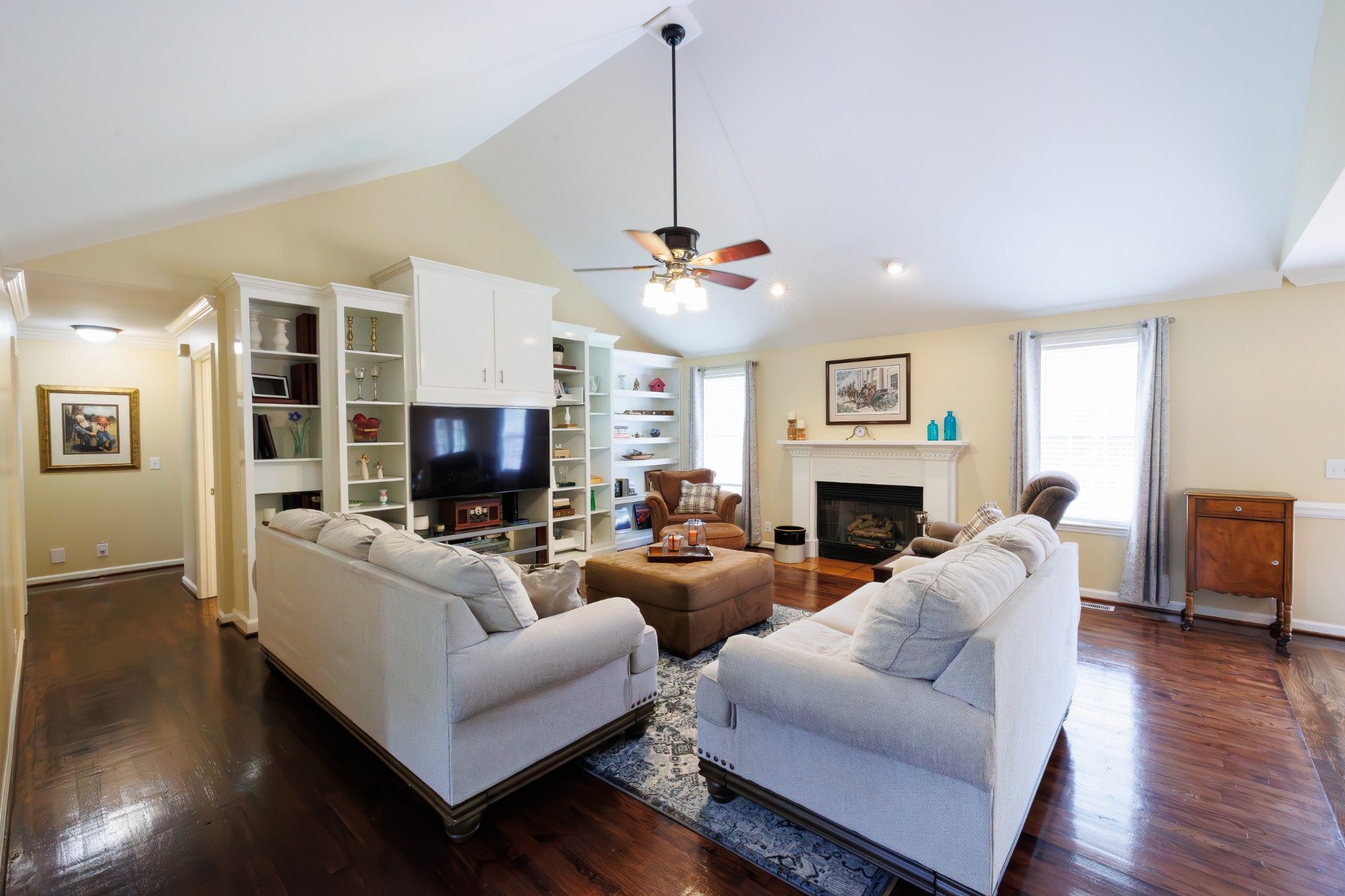4215 Pate Road Franklin, TN 37064 - Photo 6 of 34 a living room with furniture a fireplace and a flat screen tv
