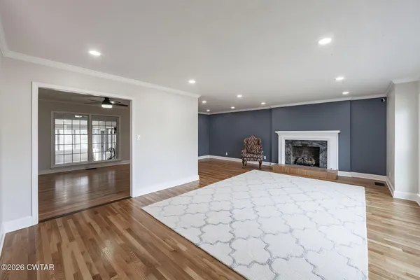 a bedroom with a bed and a fireplace