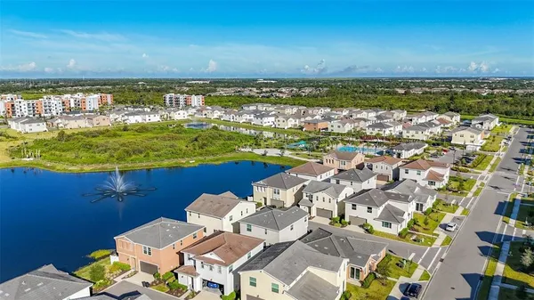 an aerial view of a residential building with outdoor space