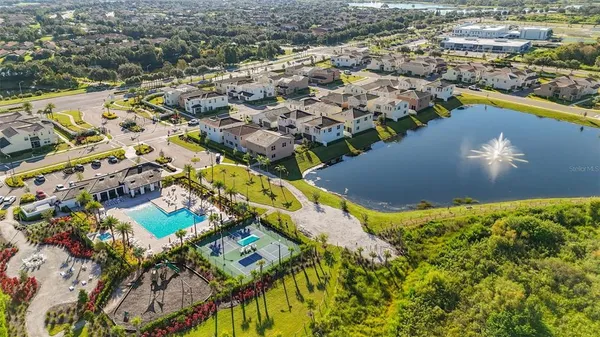 an aerial view of residential houses with outdoor space