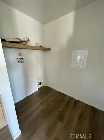 an empty room with a wooden floor