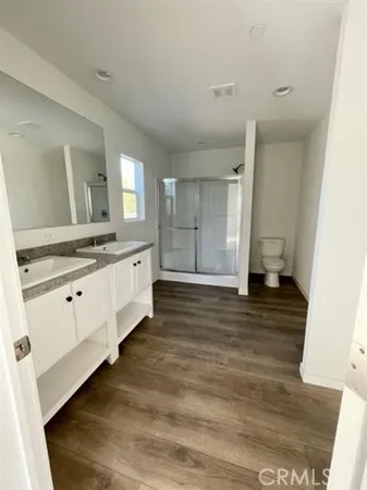 a large bathroom with a sink and a mirror