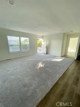 a view of an empty room and window