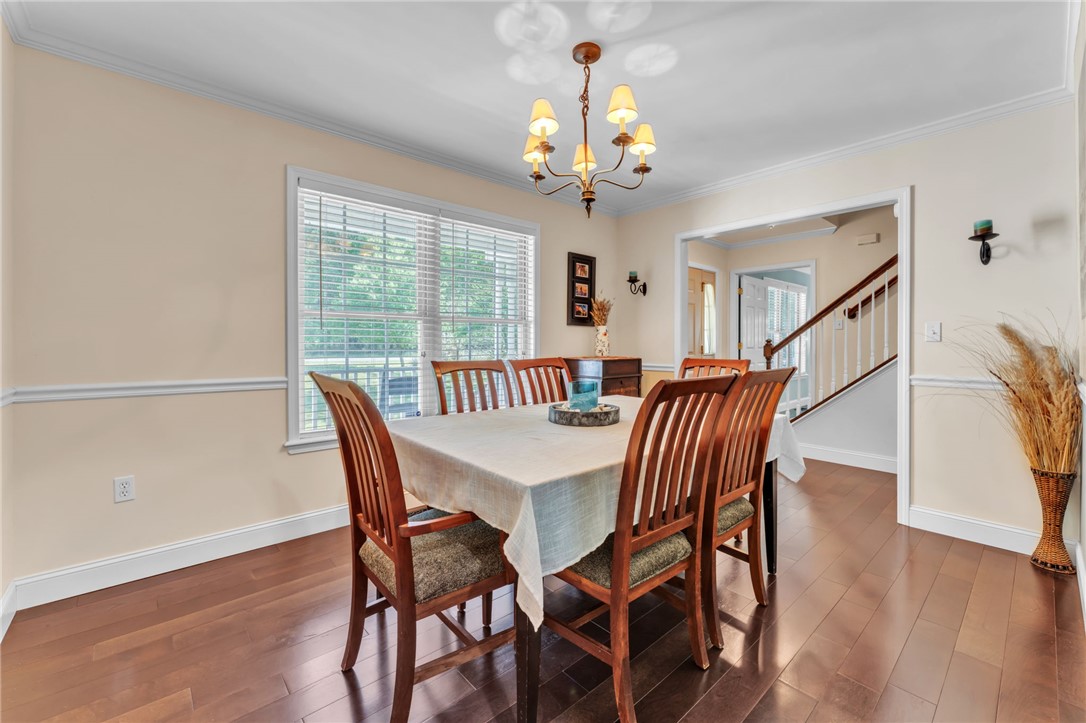 154 Hammond School Road Anderson, SC 29621 - Photo 6 of 33 Elegant dining space perfect for entertaining, featuring rich hardwood floors and a warm, inviting ambiance.