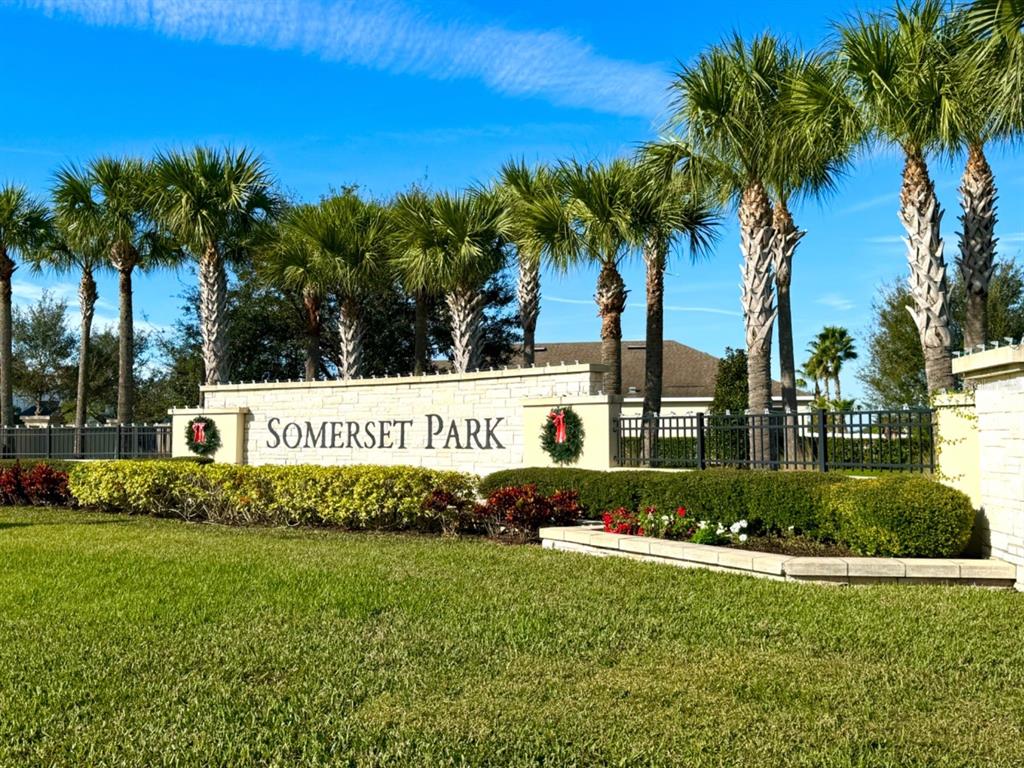 12411 Northover Loop Orlando, FL 32824 - Photo 2 of 13 a sign that is sitting in front of a white house