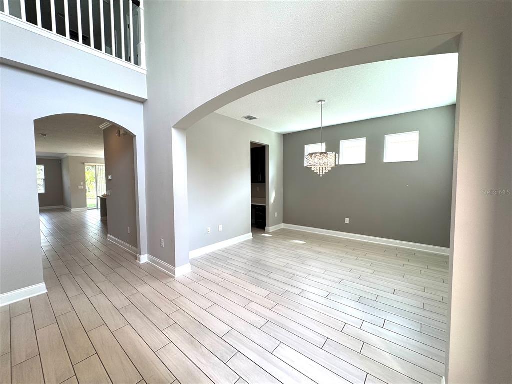 12411 Northover Loop Orlando, FL 32824 - Photo 6 of 13 a view of a livingroom with wooden floor